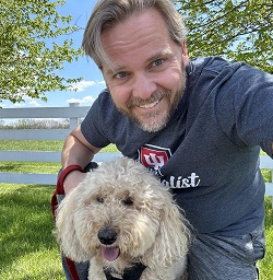 Dr Botkin hiking with his dog Apollo